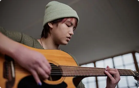 boy playing guitar