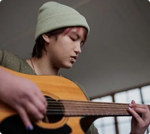 boy playing guitar